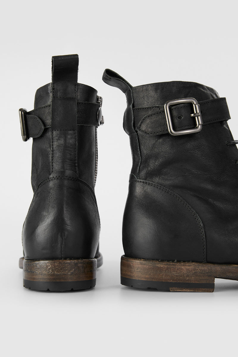 SLOANE matte-black lace-up buckle boots.