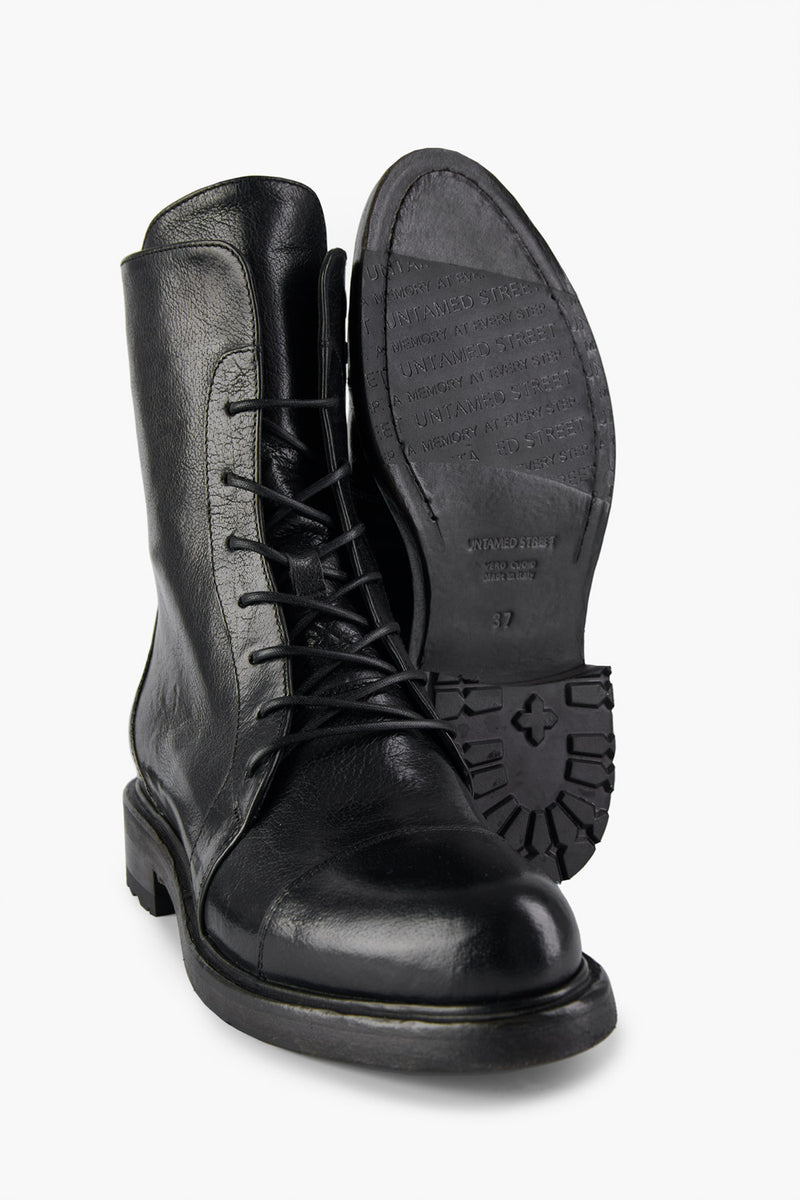 AVERY jet-black lace-up boots.