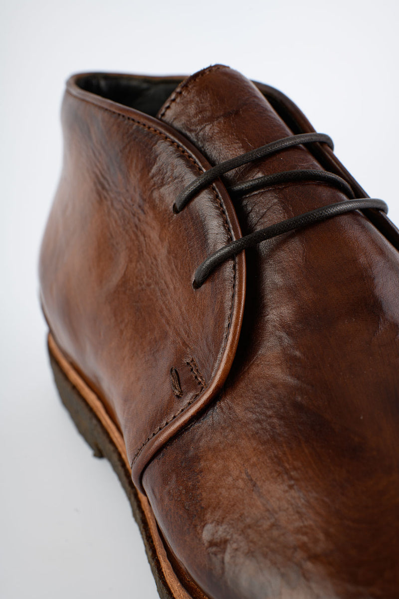 BROMPTON rich-brown chukka boots.
