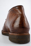 BROMPTON rich-brown chukka boots.