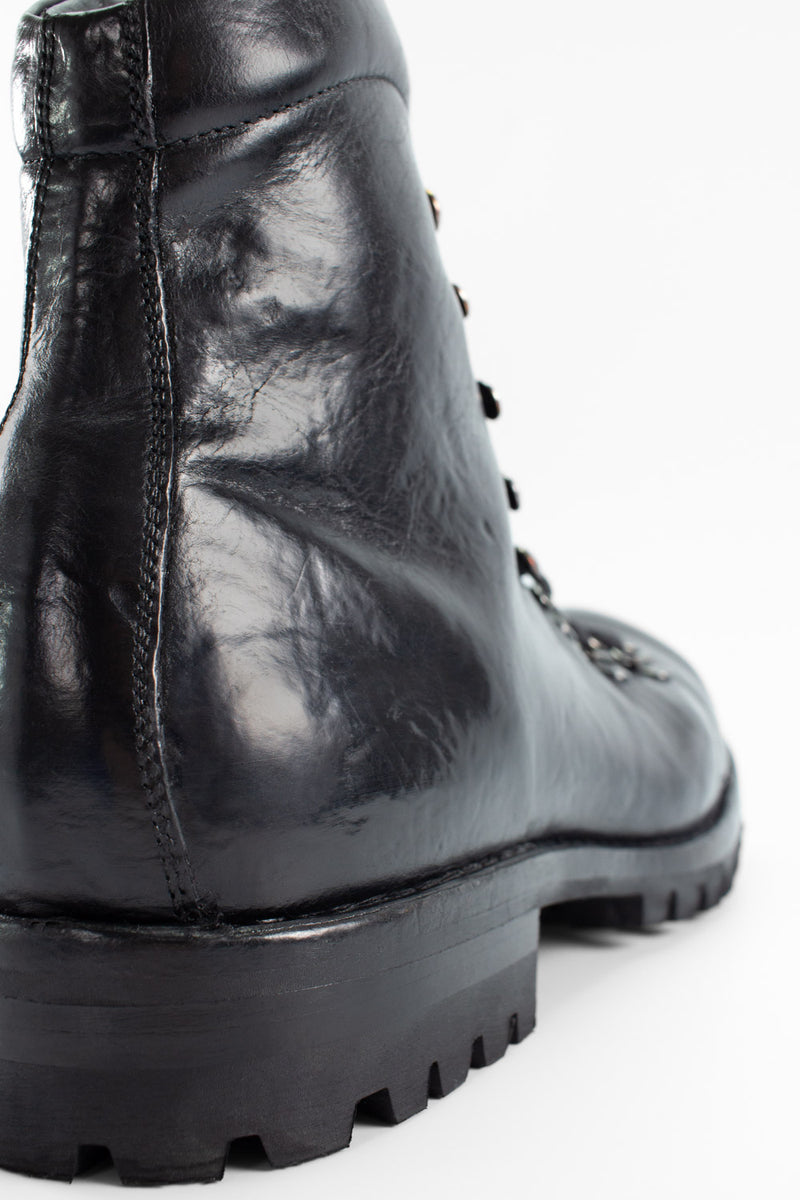 CAMDEN tar-black combat boots.