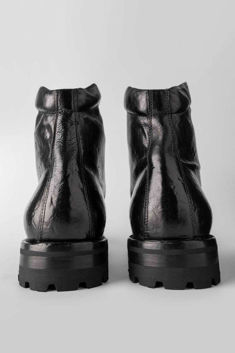 CAMDEN tar-black combat boots.