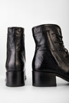 EXETER jet-black lace-up boots.