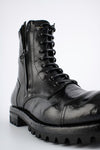 CAMDEN tar-black double-zip military boots.