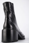 REGENT tar-black lace-up boots.