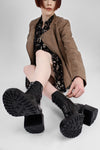 REGENT tar-black lace-up boots.