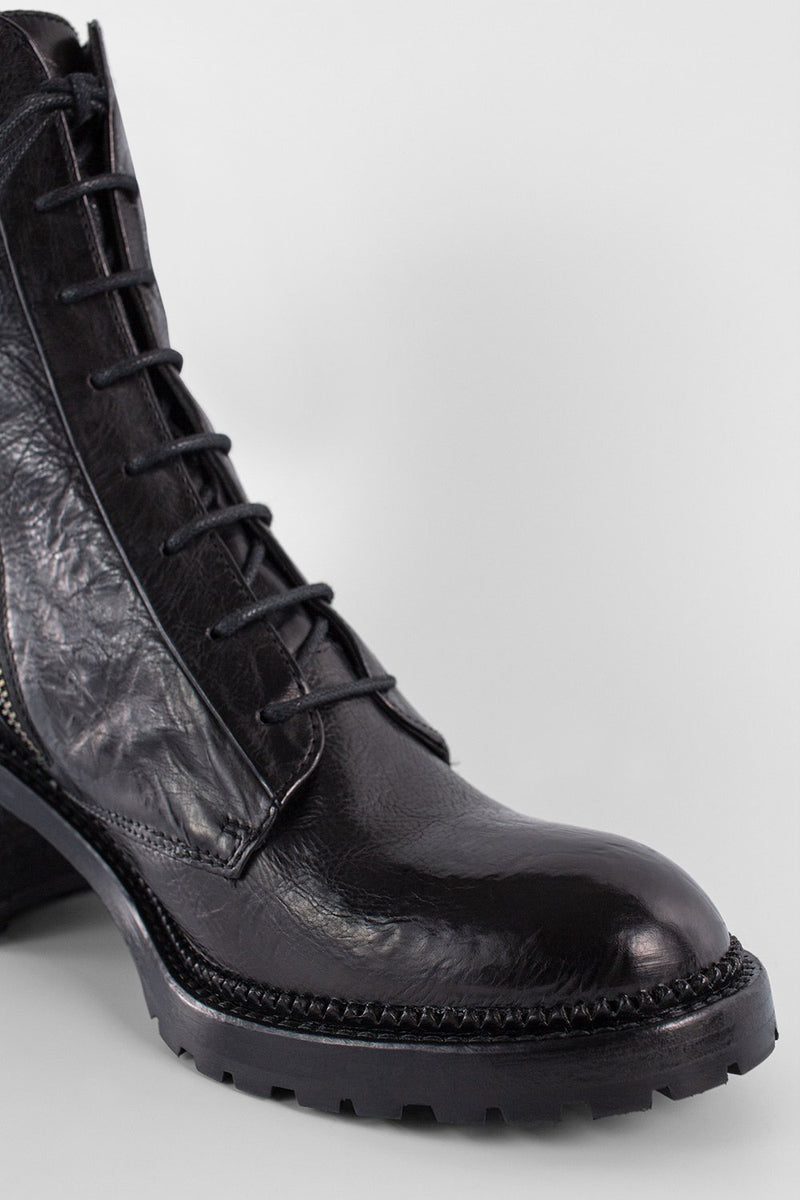 REGENT tar-black lace-up boots.