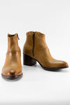 CAROE honey-tan ankle boots.