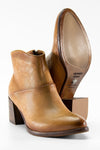 CAROE honey-tan ankle boots.