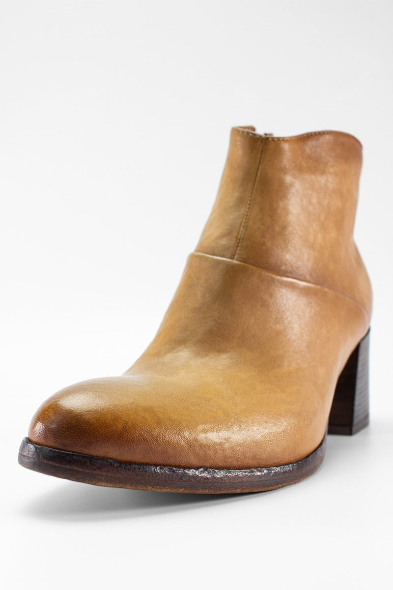 CAROE honey-tan ankle boots.