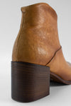 CAROE honey-tan ankle boots.
