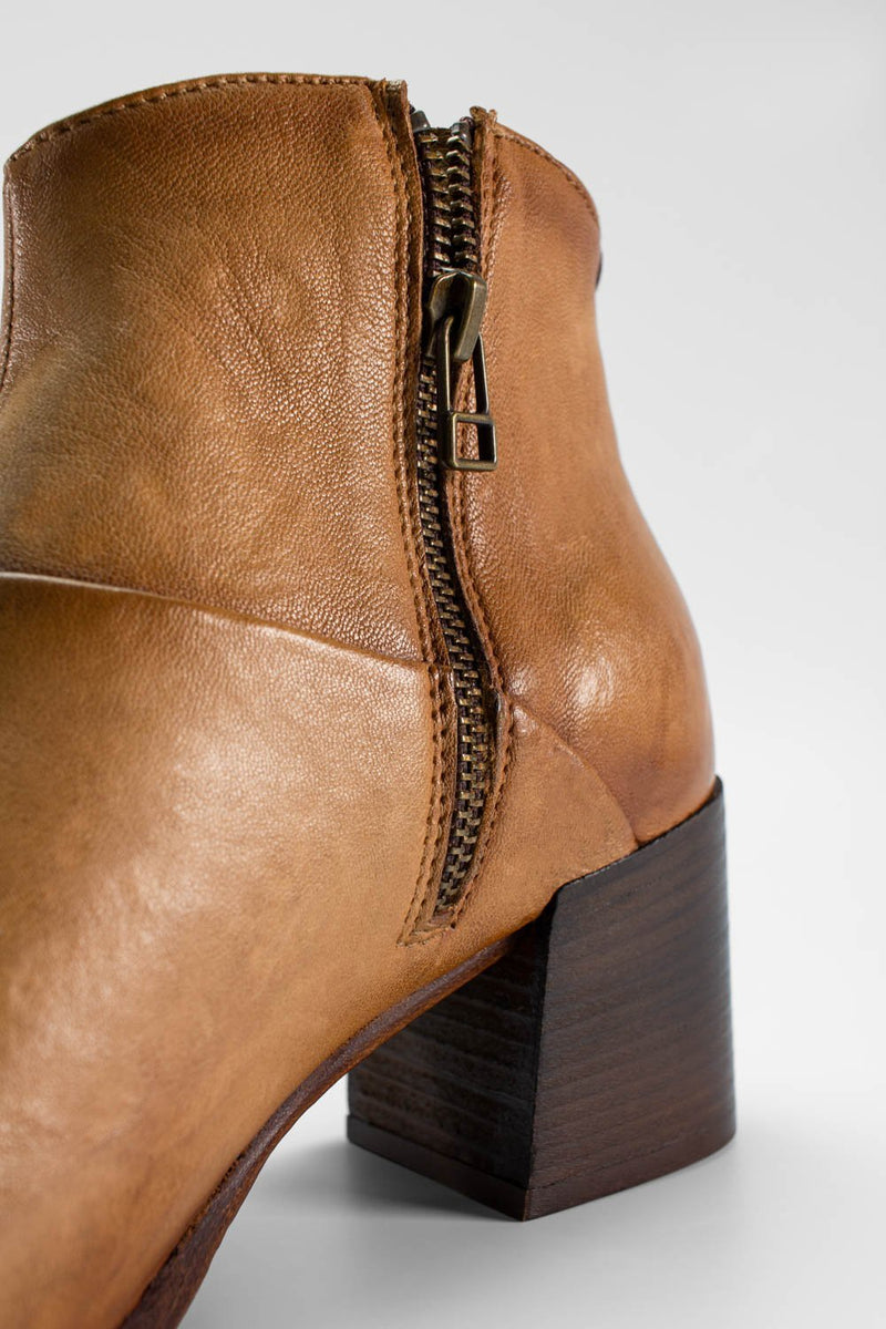 CAROE honey-tan ankle boots.