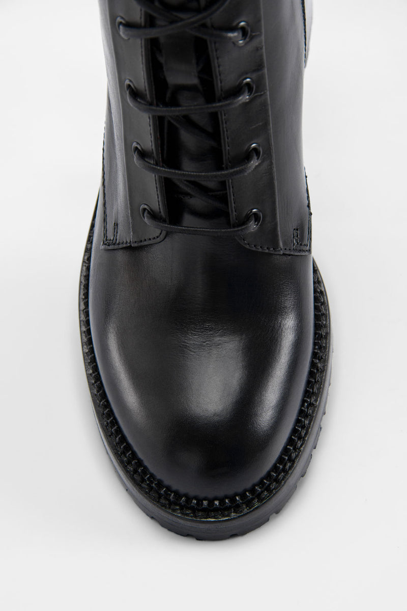 REGENT royal-black lace-up boots.