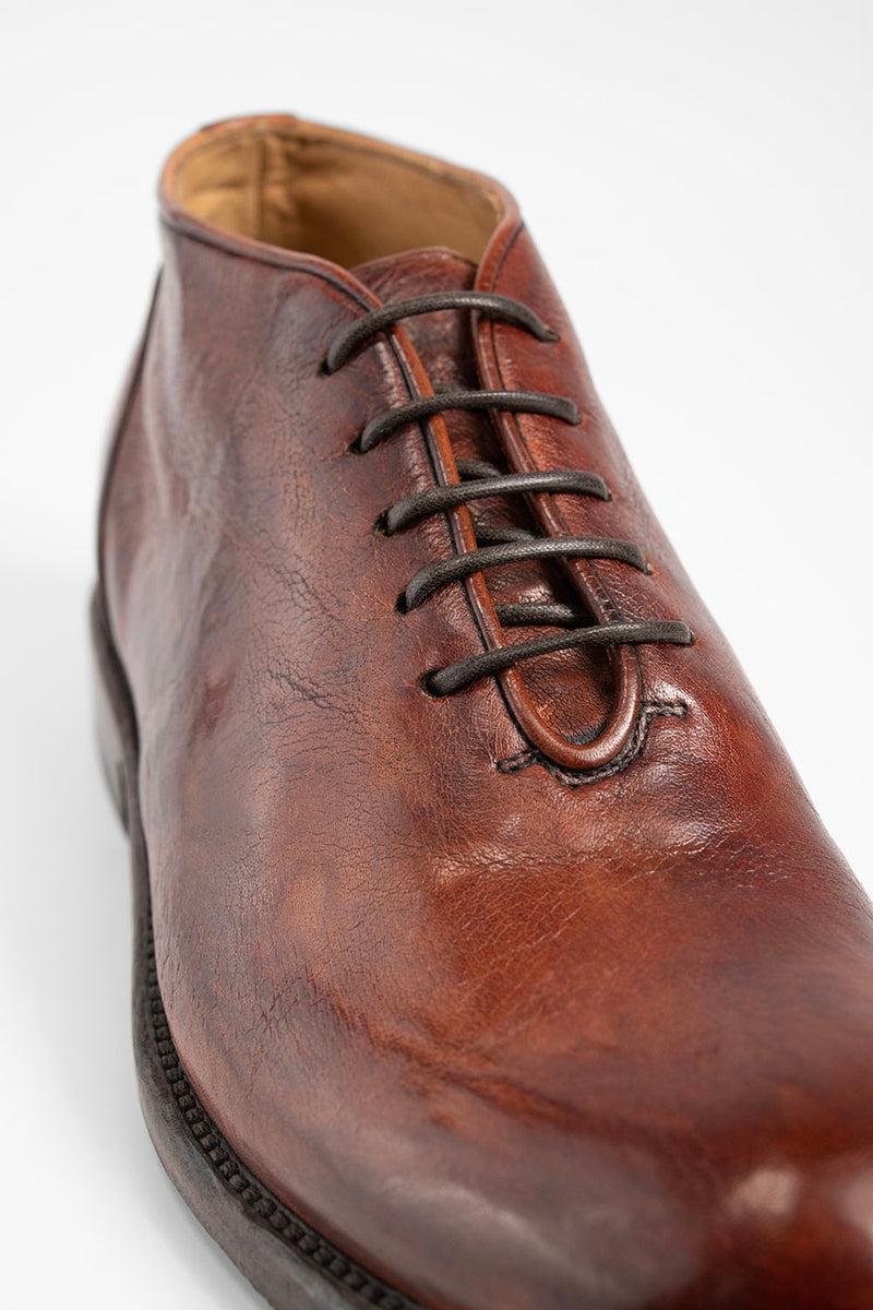 KNIGHTON rich-cognac wholecut chukka boots.