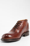 KNIGHTON rich-cognac wholecut chukka boots.