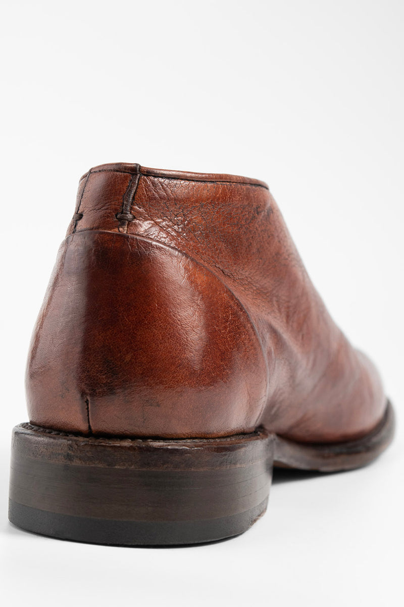 KNIGHTON rich-cognac wholecut chukka boots.