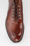 KNIGHTON rich-cognac wholecut chukka boots.