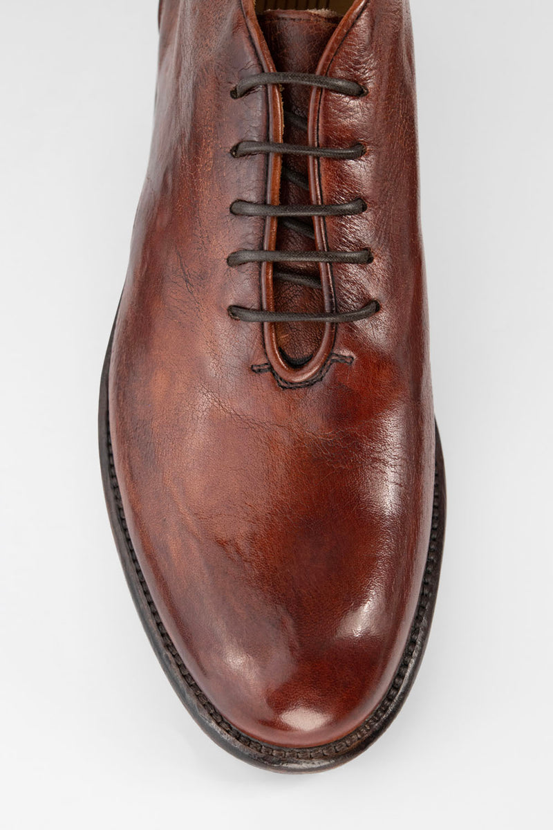 KNIGHTON rich-cognac wholecut chukka boots.