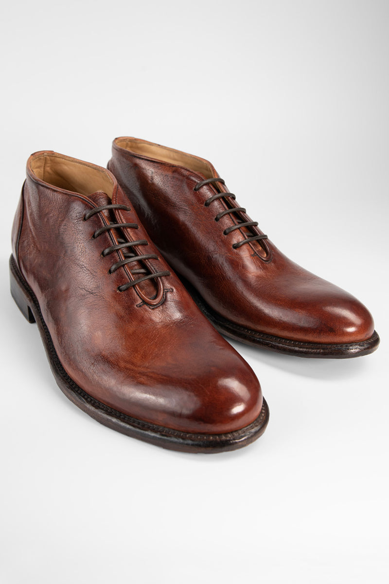 KNIGHTON rich-cognac wholecut chukka boots.