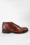 KNIGHTON rich-cognac wholecut chukka boots.